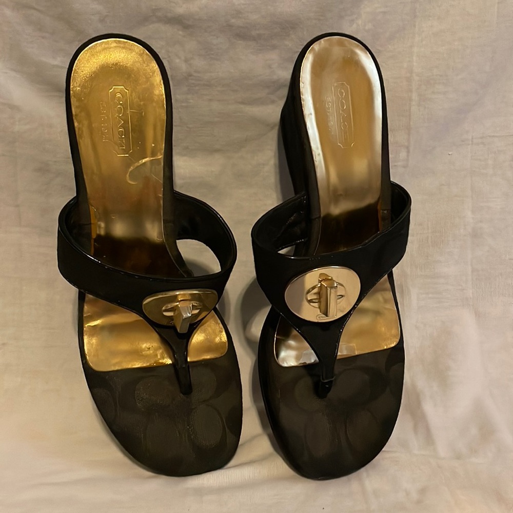 Woman’s black coach Sandals